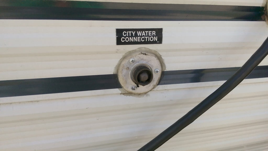 Original City Water Connection. Remove the three screws to begin the removal process.