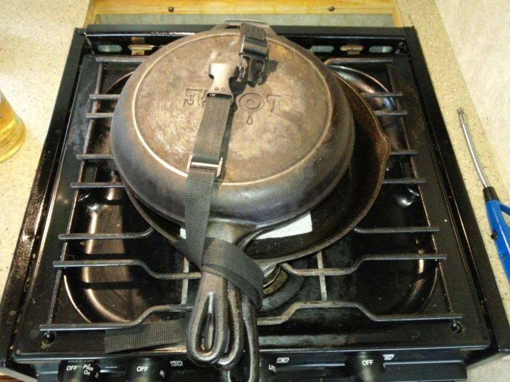 Safely strapping down Lodge cast iron pans for travel mode in a motor home